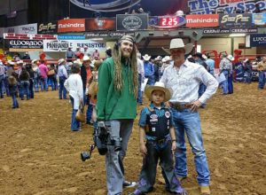 Doty's cameraman Landon and Doty filming a Western Wishes segment for This Is Country  with a wish kid at the CBR bull riding. (Courtesy of Brian Doty)